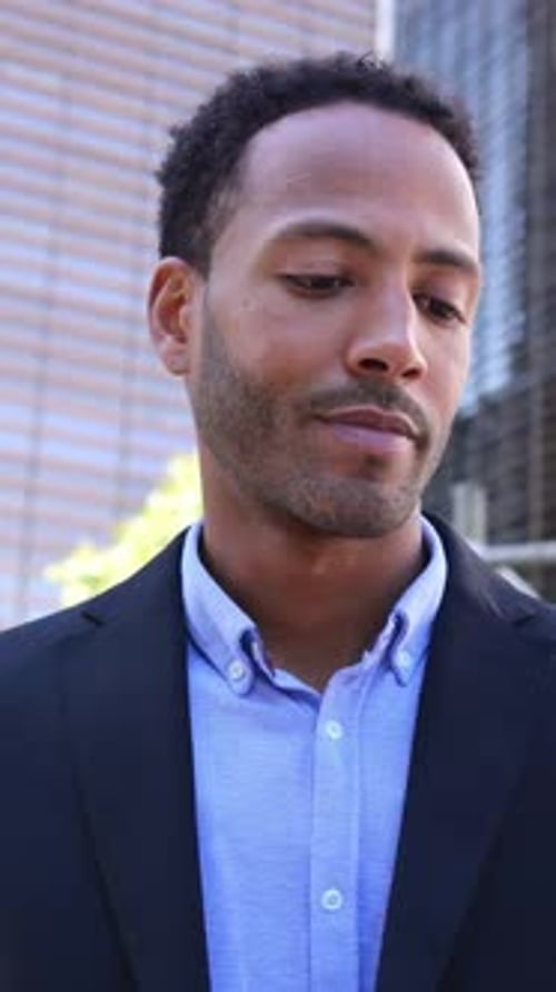 Young Attractive African American Business Man Using Mobile Phone at City