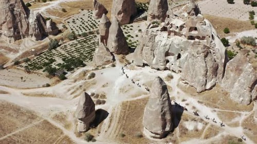 Cappadocia Desert Landscape with People Horseback Riding