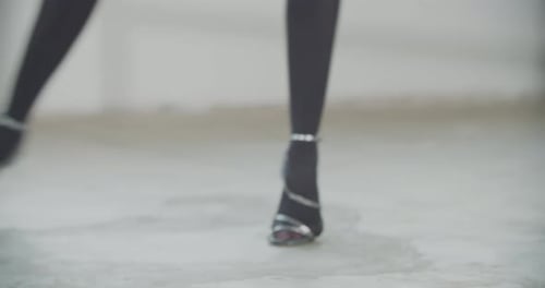 Auburn Haired Woman Practices Ballet in Studio