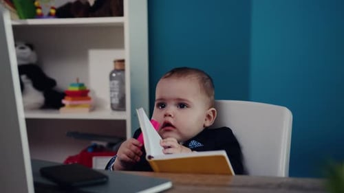 Cute Infant "Working" at Desk with Laptop
