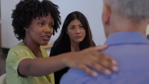 Diverse Group of People in Therapy Session at Community Center