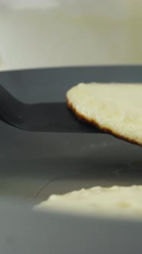Vertical Of Pancake Flip On A Pan. Close-up Shot
