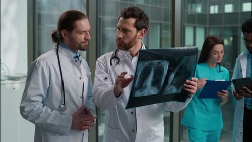 Medical Team Discussing X-Ray in Modern Hospital