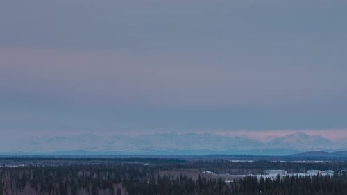 Sunset time-lapse with Alaskan Mountain range during winter
