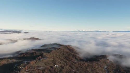 Breathtaking Aerial View Above Clouds and Mountains