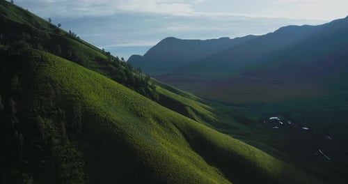 Aerial Drone View of Green Hills in Bromo Mountain Landscape