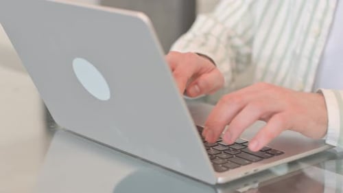 Close up of Hands Typing on Laptop