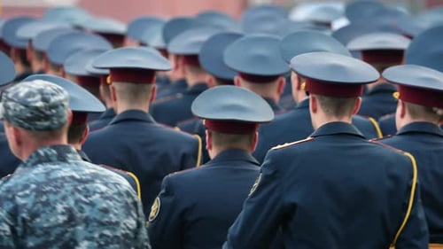 Large Group in Uniforms Marching Together