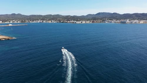Aerial drone footage of the town of Sant Antoni de Portmany on the west coast of Ibiza in Spain