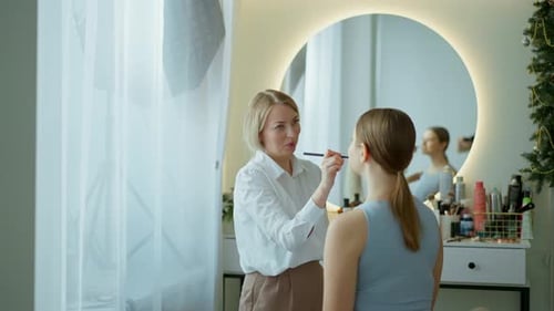 Makeup Artist Work in Her Beauty Studio Portrait of Woman Applying By Professional Make Up Master