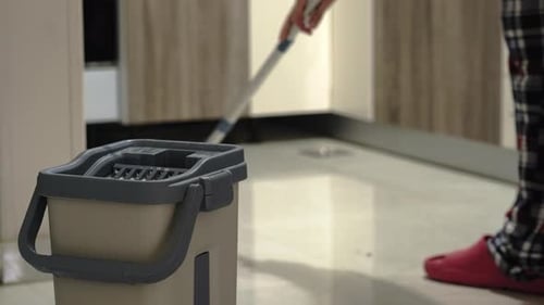 Man Mopping Floor at Home