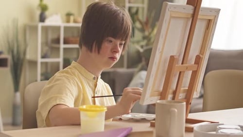 Child Painting Art on Canvas at Home