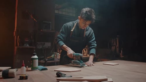 Carpenter and His Small Family Business Young Man Works in His Workshop Polishing Wooden Parts and