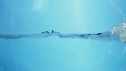 Close up of Rippling Water on Blue Background