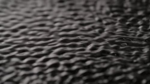 Water Surface Monochrome Light Moving Waves and Ripples Under Ultra Sound Vibrations Abstract