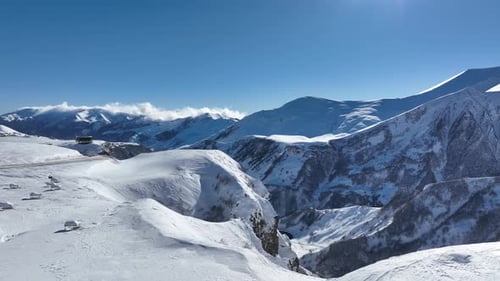 Aerial view of beautiful snowy mountains in Gudauri, Georgia