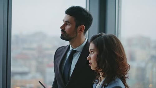 Two Teammates Communicating Office Corridor Looking Panoramic Window Close Up