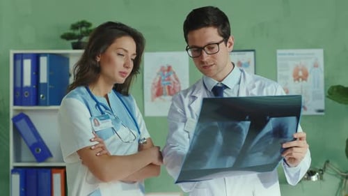Doctors review an X-Ray in a Hospital Office