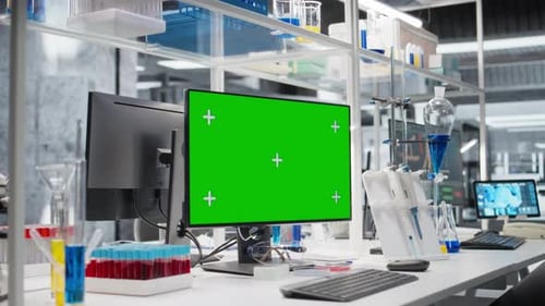 Blood Samples Next to Green Screen PC in Laboratory
