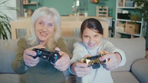 Grandmother and Child Playing Video Games Together