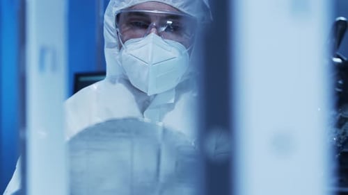 Professional Engineer is Developing a Modern Microprocessor in a Futuristic Laboratory Using
