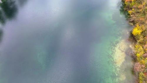 Aerial Drone Footage 4k of autumn lake shoreline