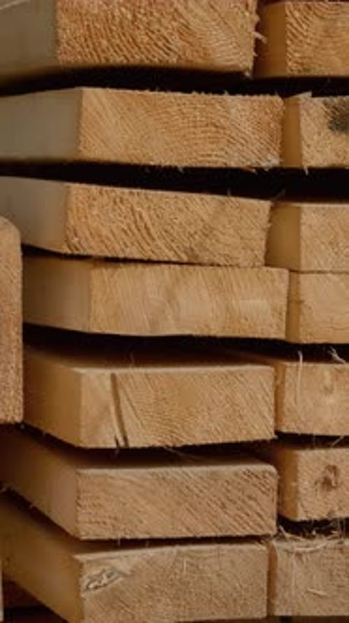 Neatly Stacked Lumber Planks, Wood Boards, Construction Material