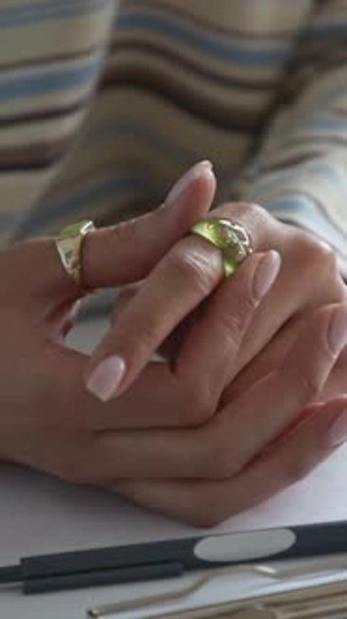 Close Up of Hand with Gold Rings