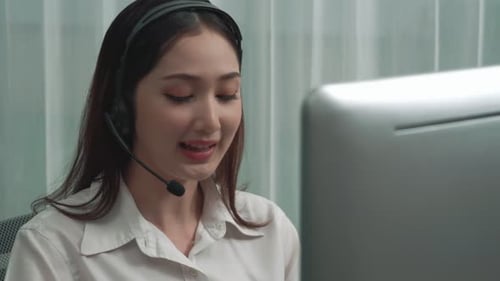 Enthusiastic female operator provide helpful customer service to customer.