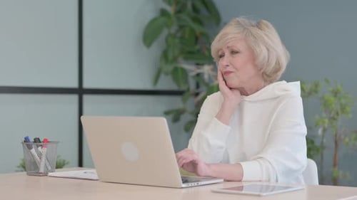 Portrait of Old Woman having Toothache at Work
