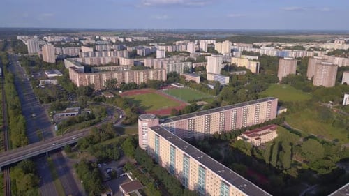 cityscape sports field amidst high rise buildings. Amazing aerial top view flight
panorama overview