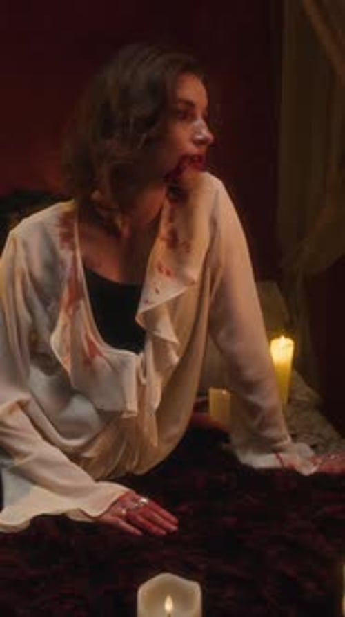 Portrait of Dazed and Smiling Vampire Woman in Blood-Stained White Blouse