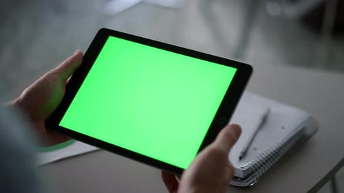 Entrepreneur Hands Holding Tablet Computer Looking Green Screen in Home Office. Close