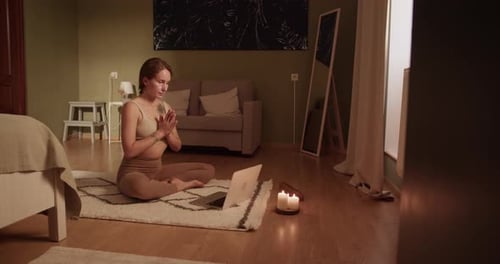 Woman Meditating During Online Lesson