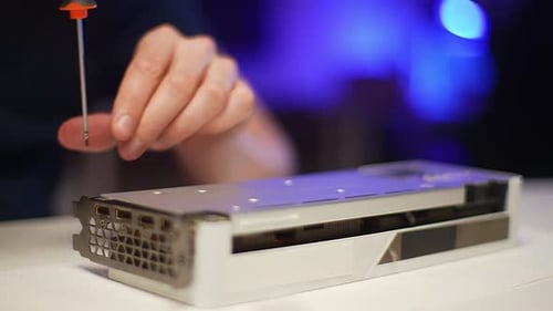 Engineer Male Working in Electronic Workshop or Hardware Computer Service Assembling Modern Graphics