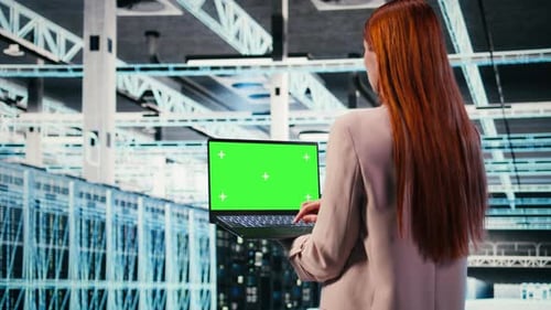 Green Screen Mockup Laptop Used By Server Hub Worker to Do Maintenance