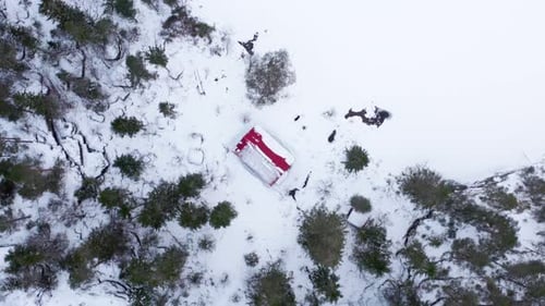 Topdown View Of A Cabin Amidst The Winterly Landscape. Aerial Drone Shot