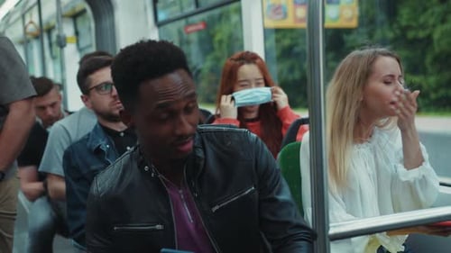 People riding the bus during the day