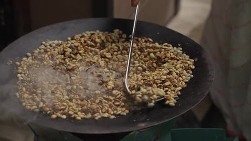 Coffee Beans Being Roasted in a Pan