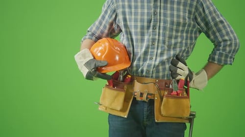 Construction Worker Holding Hard Hat on Green Screen