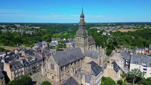 Saint Sauveur basilica, Dinan, France. Aerial drone backward and sky for copy space