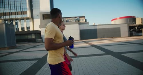 Man and Woman Walking Together in Urban Setting