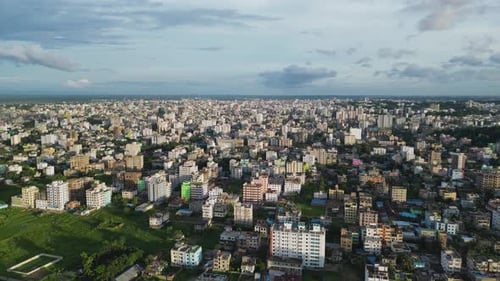 An aerial view of the city from above, showcasing the intricate layout of buildings, roads, and gree