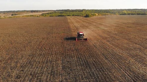 Harvester Working in a Vast Rural Field
