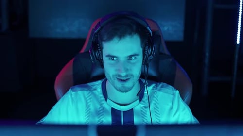 Excited Young Adult Male Playing Computer Game