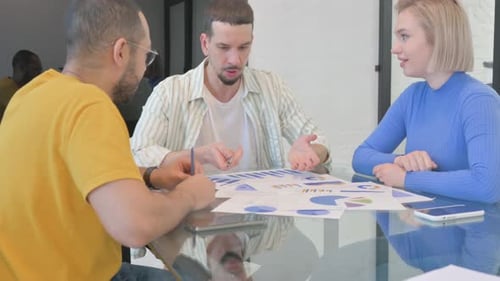 Business Meeting with Chart and Graph Review