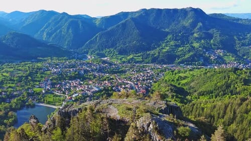 View From Rock to Town of Smolyan with Meadows for Cattle Walking and Houses Between Mountain Range