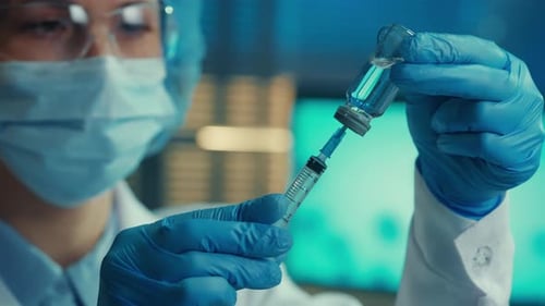 Healthcare Worker Preparing Vaccine in Laboratory Setting