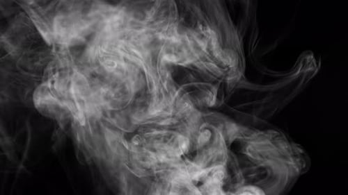 Billowing White Smoke Rises on Black Background