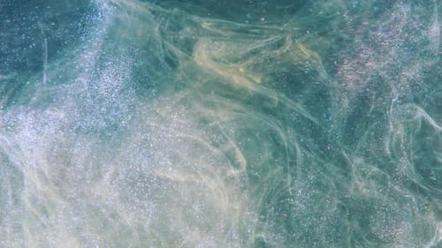 Glittering Abstract Swirls of Light Blue and Gold